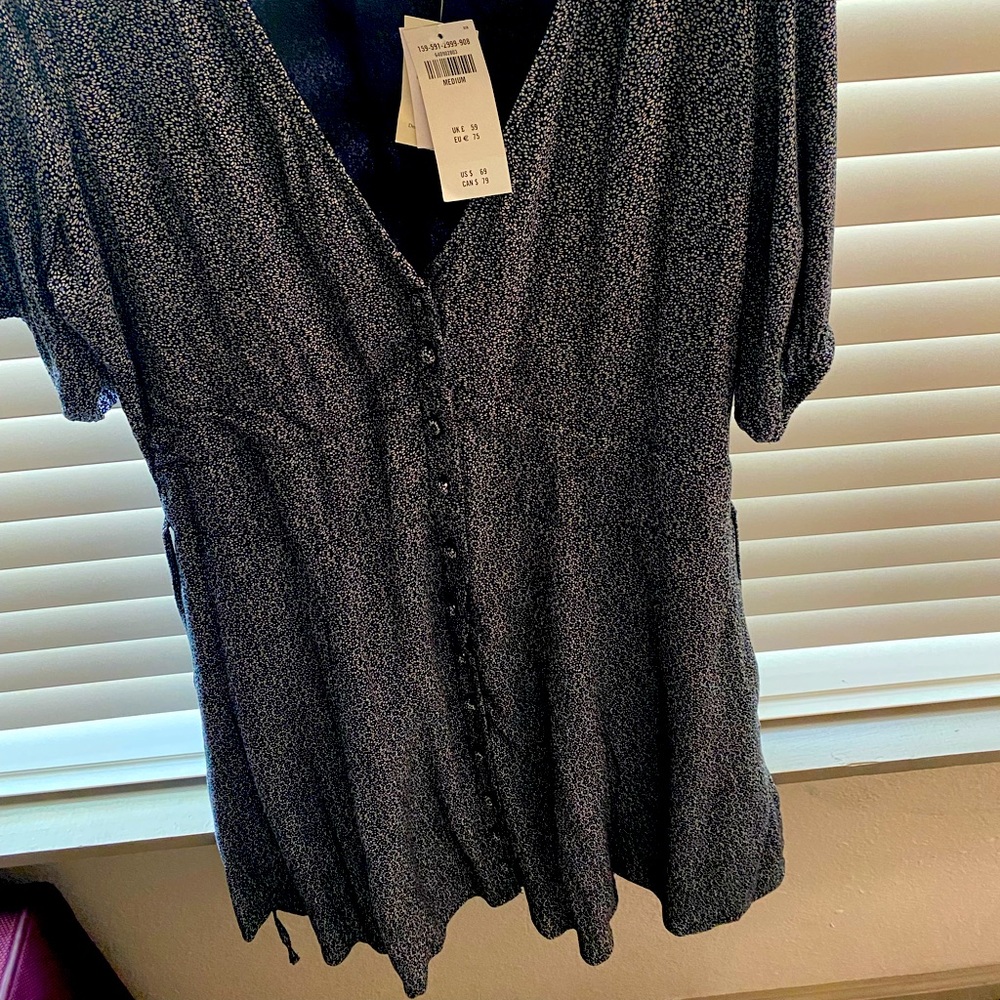 Mini dress with buttons down front. Size Medium